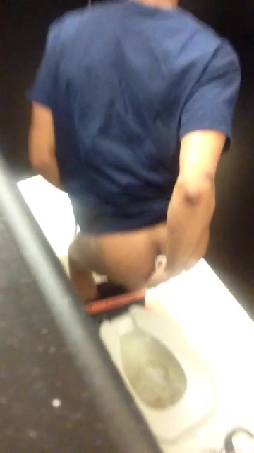 SPY young guy pooping