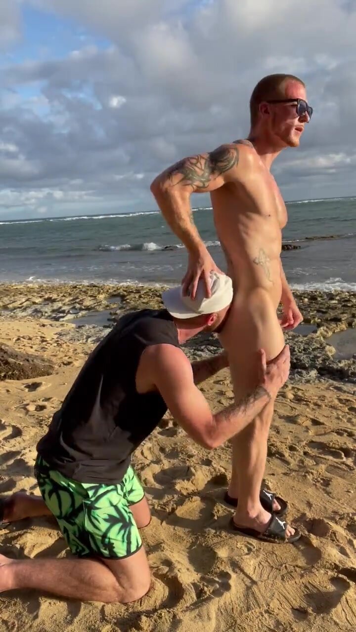 Naked guys in the beach having fun