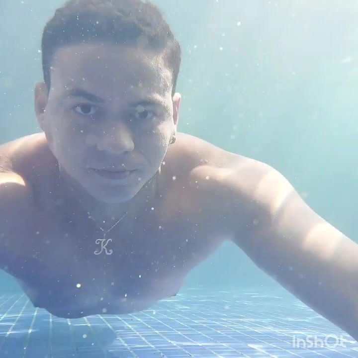 Sexy guy swimming barefaced underwater