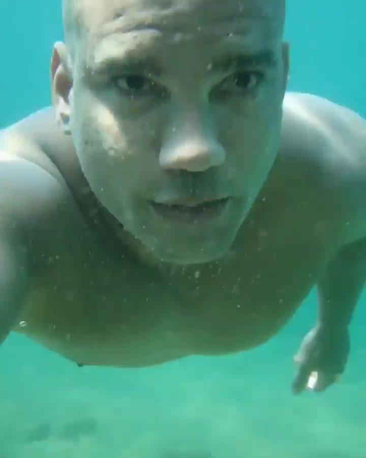 Barefaced bald hottie underwater