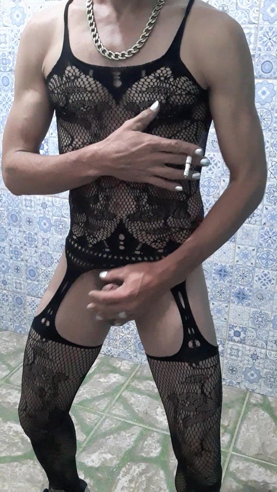 Boy with lingerie and silver nails smoking