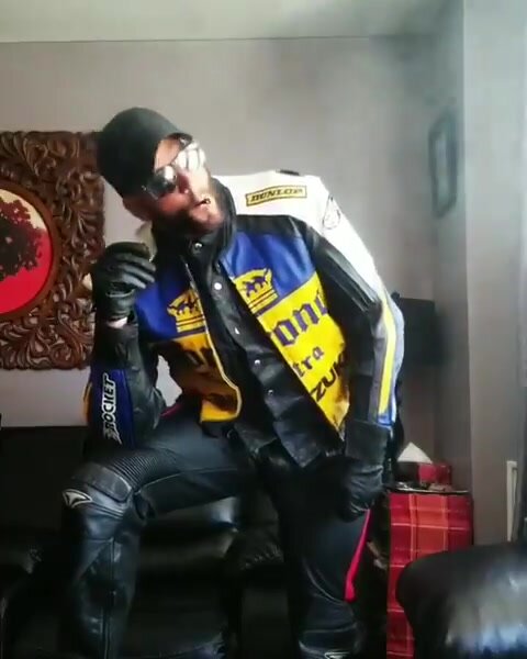 Leather biker smoking - video 3