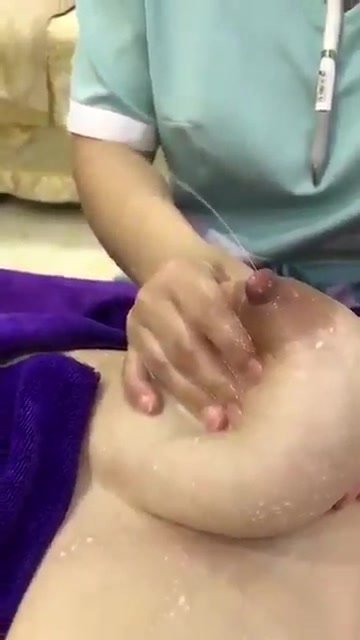 Nurse milking big tits