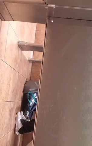 Woman pooping understall