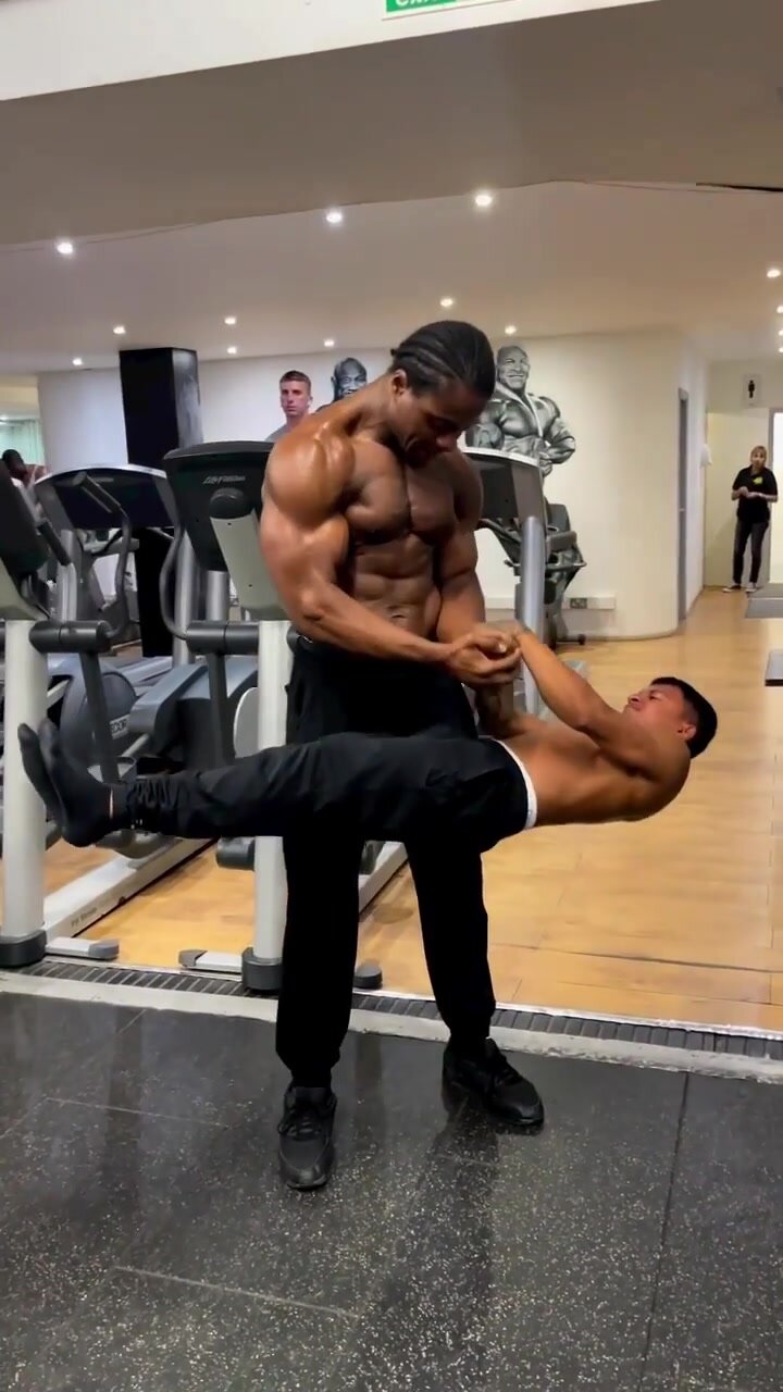 big bodybuilder uses his tiny friend to worout