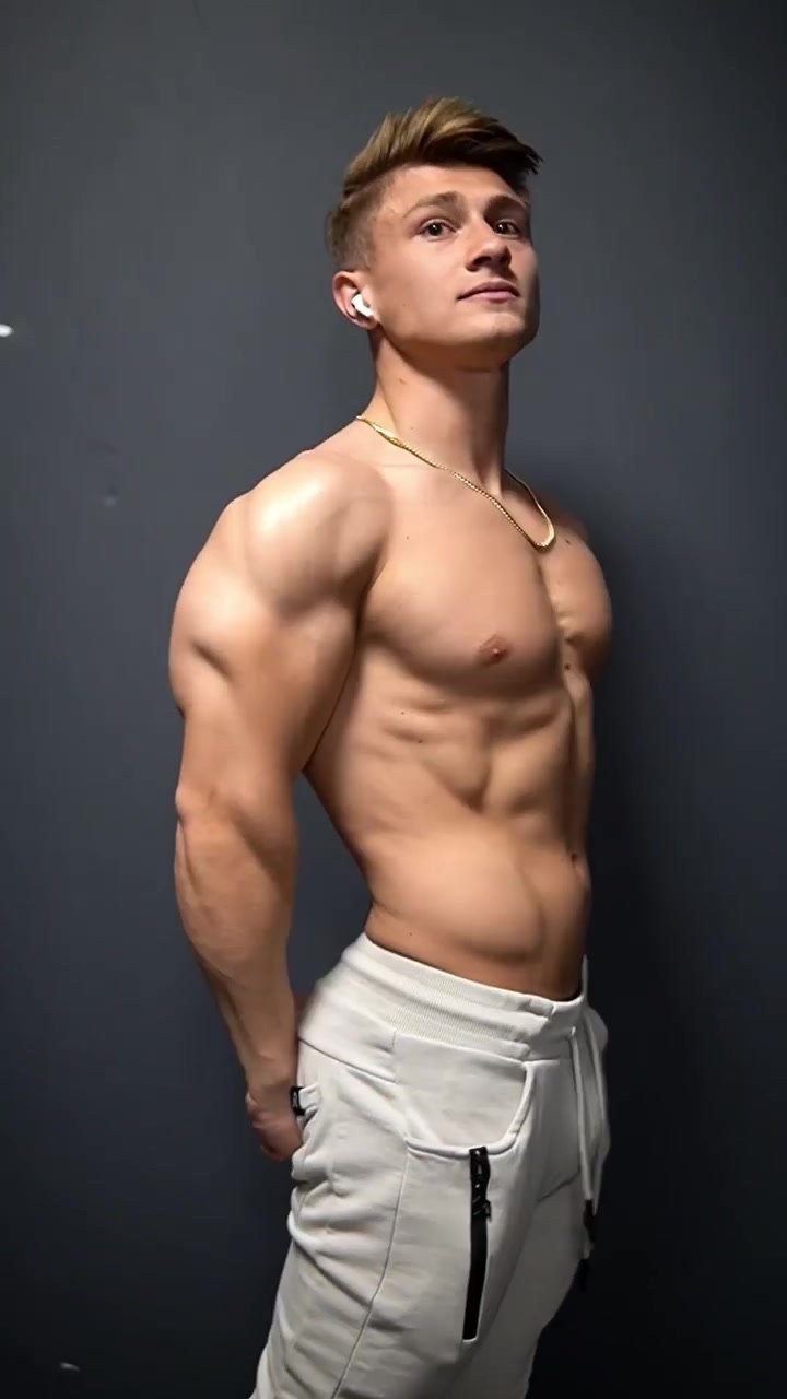 sexy college jock flexes his muscles