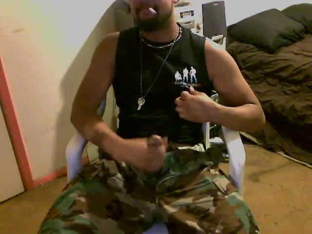 cammo guy smokes while having a wank and cums