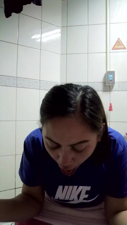 Cute Girl heaves and pukes into toilet