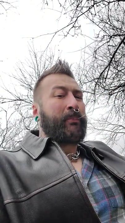 leather bear smokes and spits
