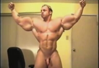 Naked bodybuilder flexing
