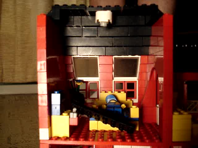 Giant busts into lego house with socks then barefeet.