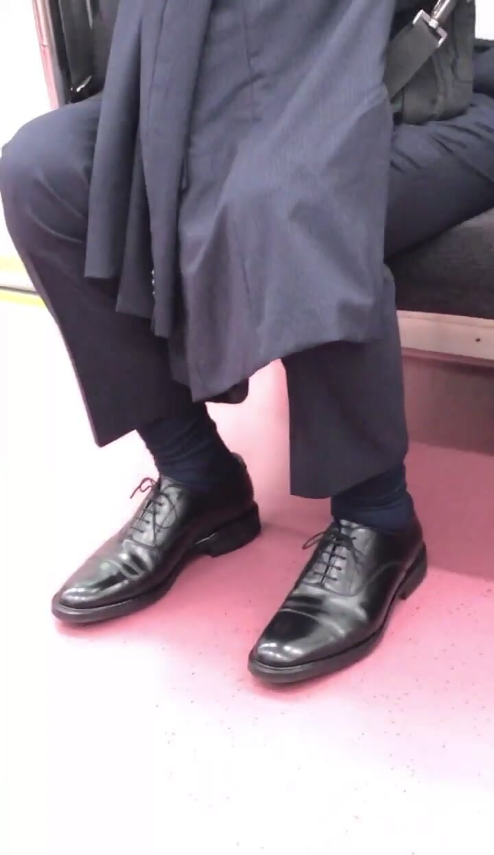 Japanese suit guy on train