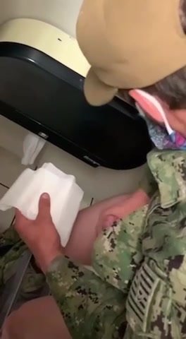 military man jerks off in the toilet and cums