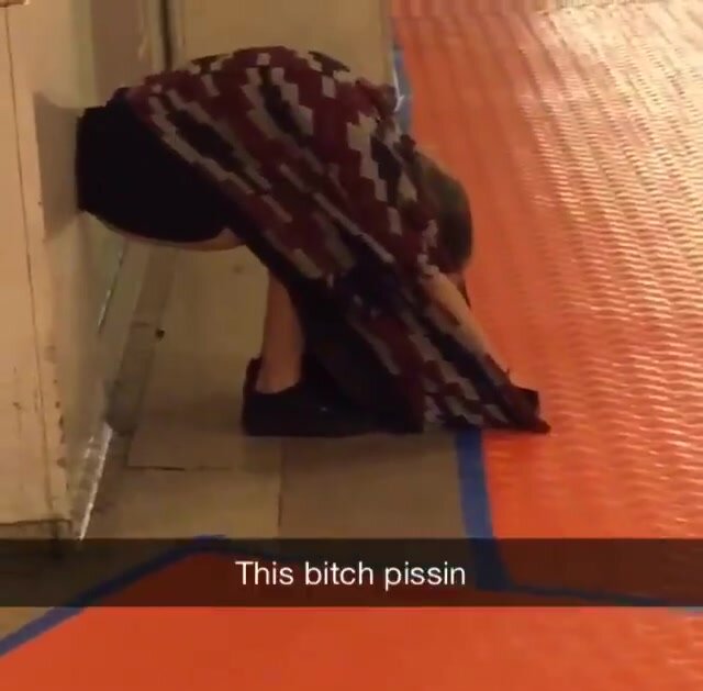 Woman peeing on a platform