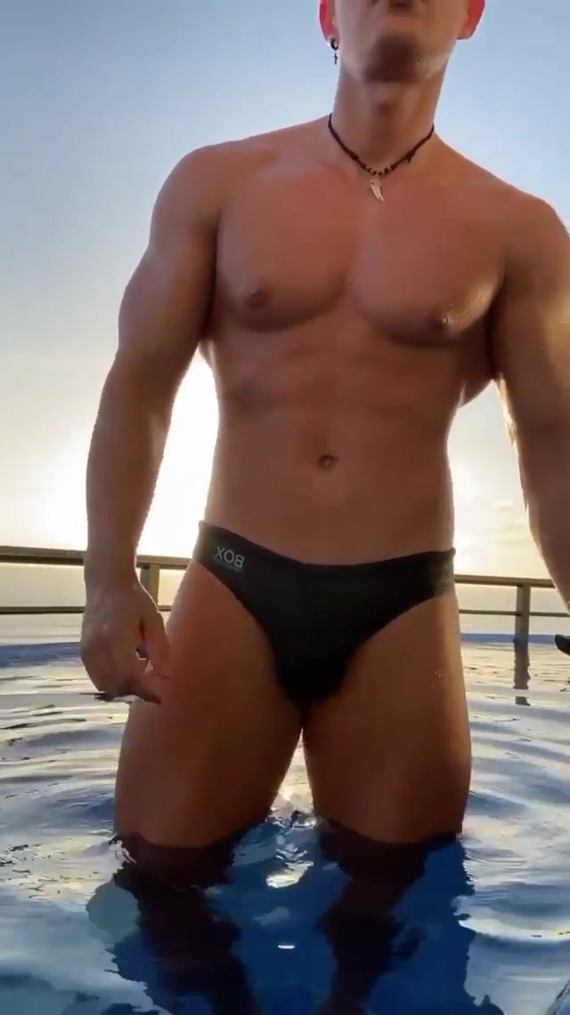 Fit guy posing in sunset