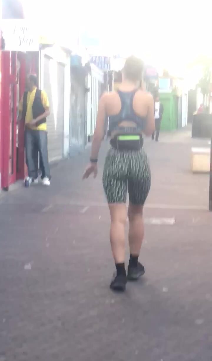 Sporty brunette walking in public part 2