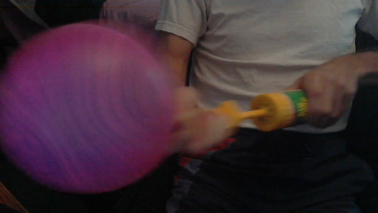 Pump to pop an old purple latex balloon to shreds!