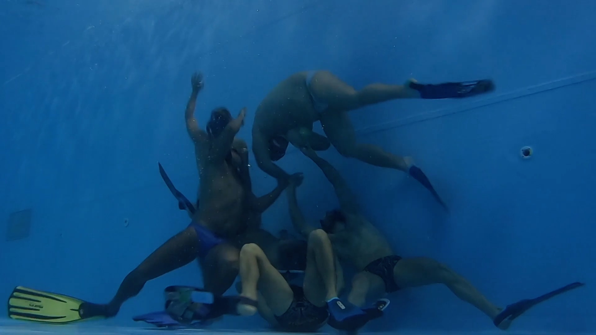 Bunch of Lads Wrestling Underwater in Speedos
