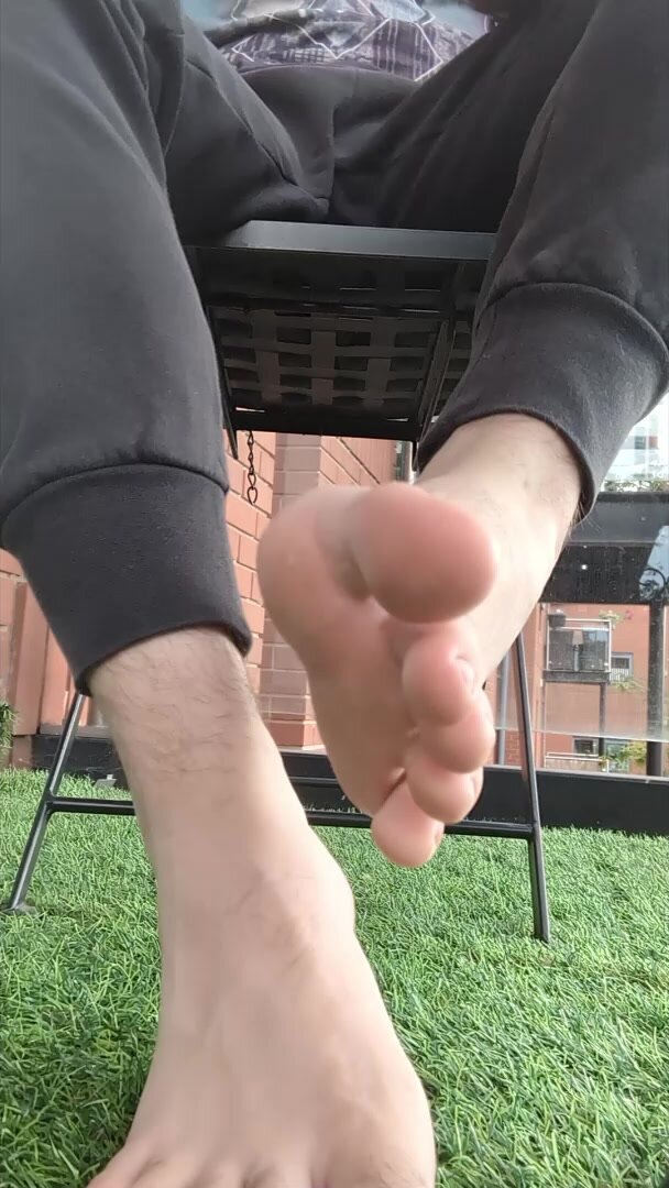 Foot slave trapped under big sweaty feet