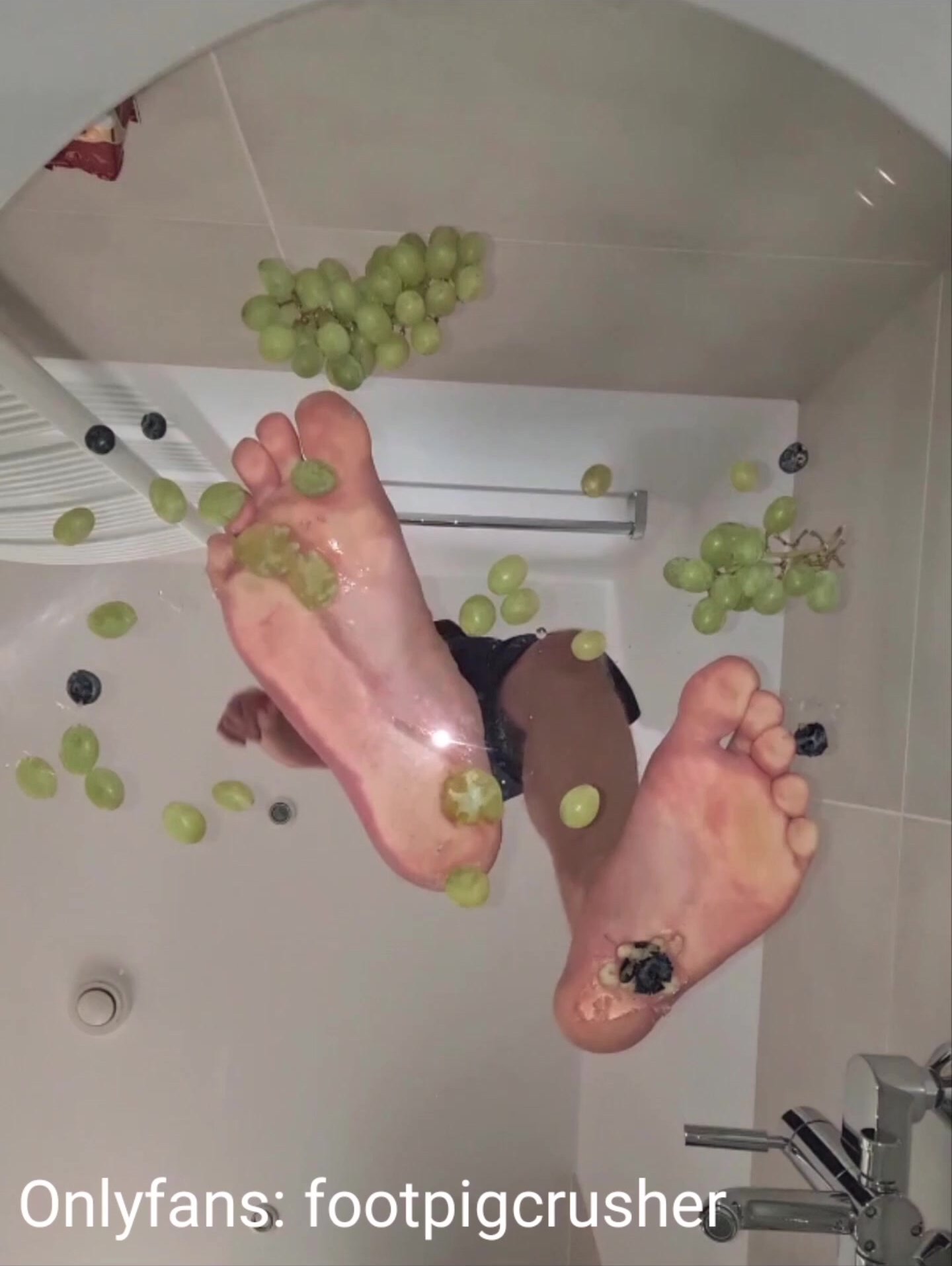 Underglass crushing grapes under my naked foot soles