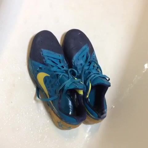 Pissing on trashed Nike KD sneakers