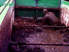 worker playing in slurry container
