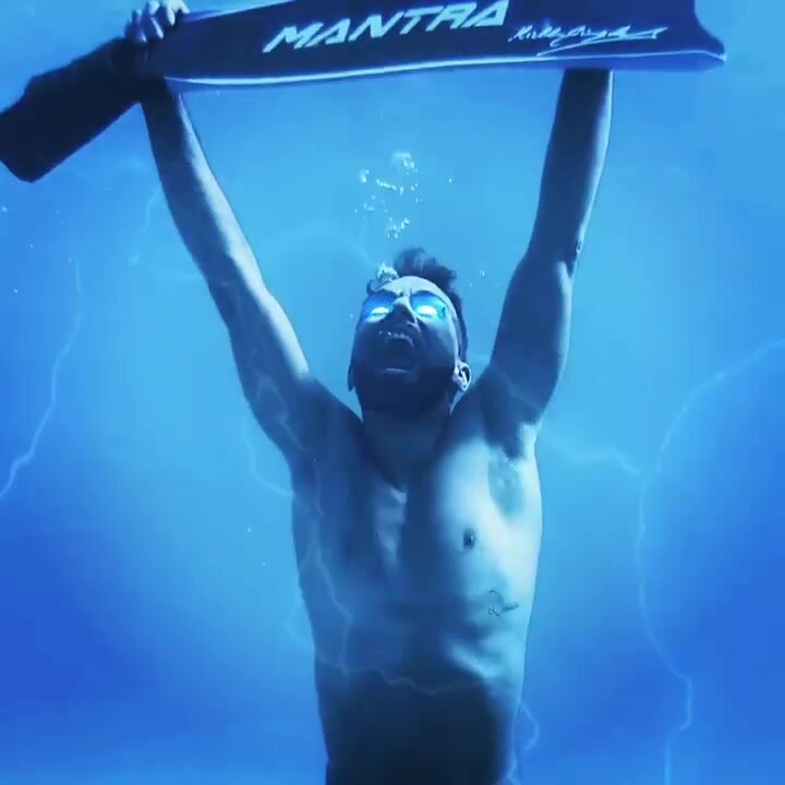 Barefaced italian freediver going wild underwater