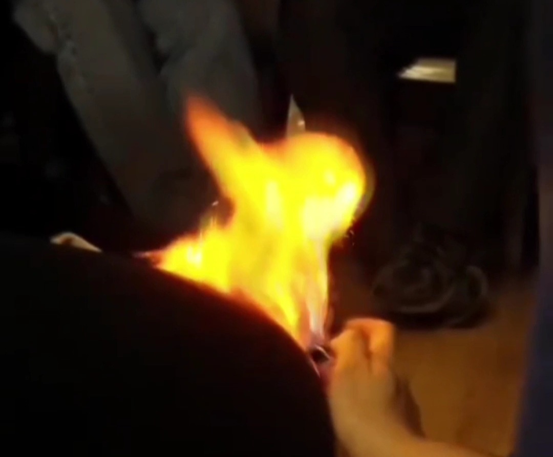 Blonde woman farts on fire slow motion