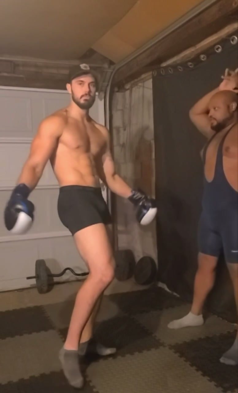 Hot boxer flexes muscle and dominates
