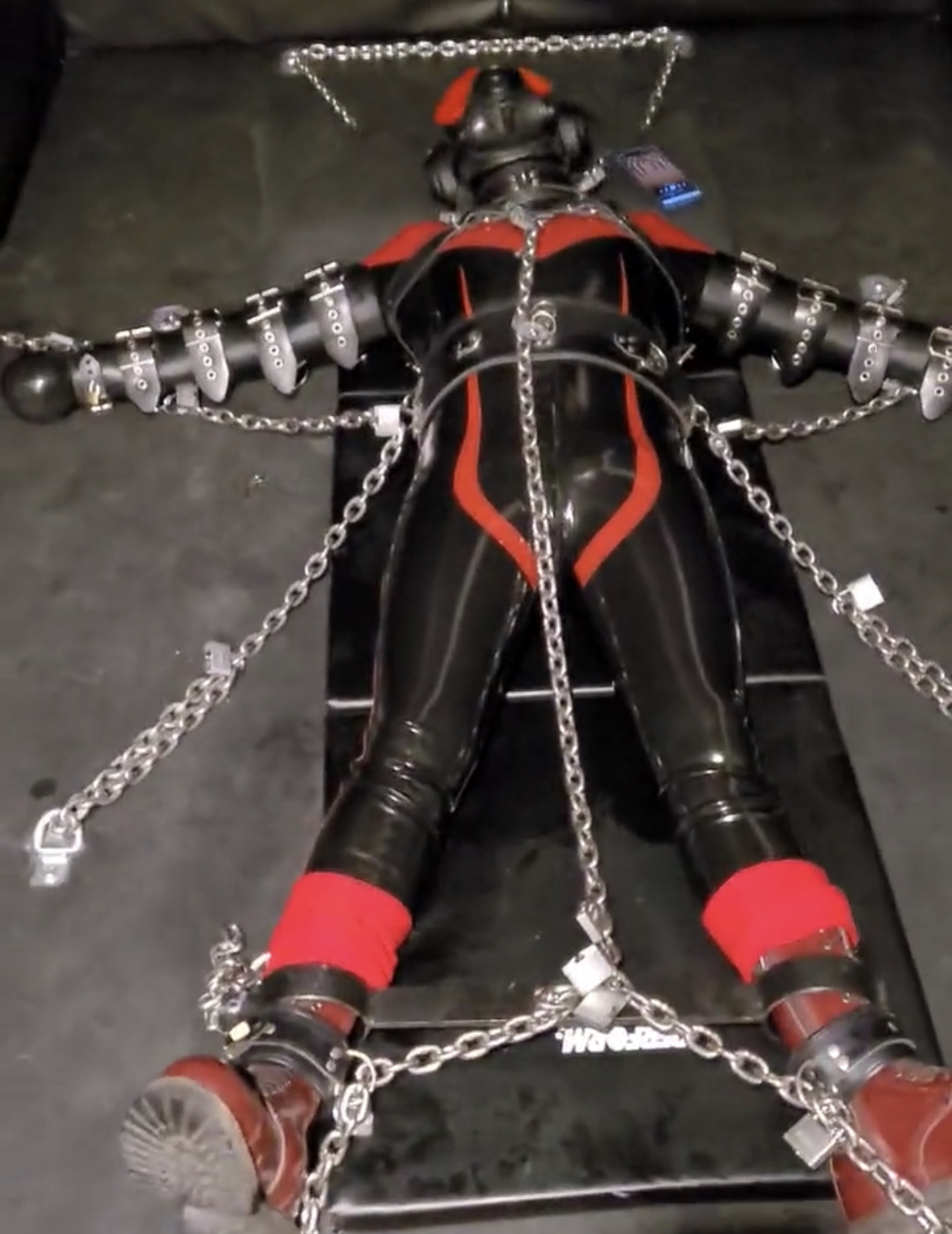 Full rubber gimp chained with electro plug