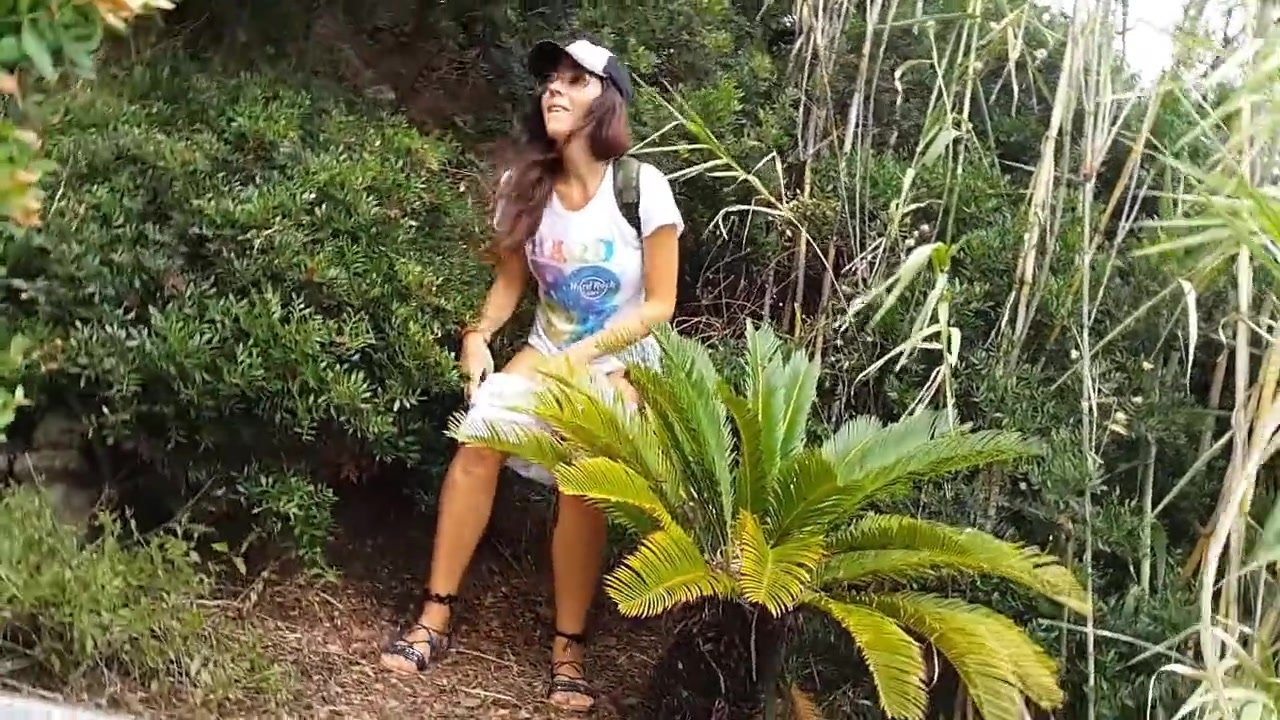 Sexy girl pees in the bushes