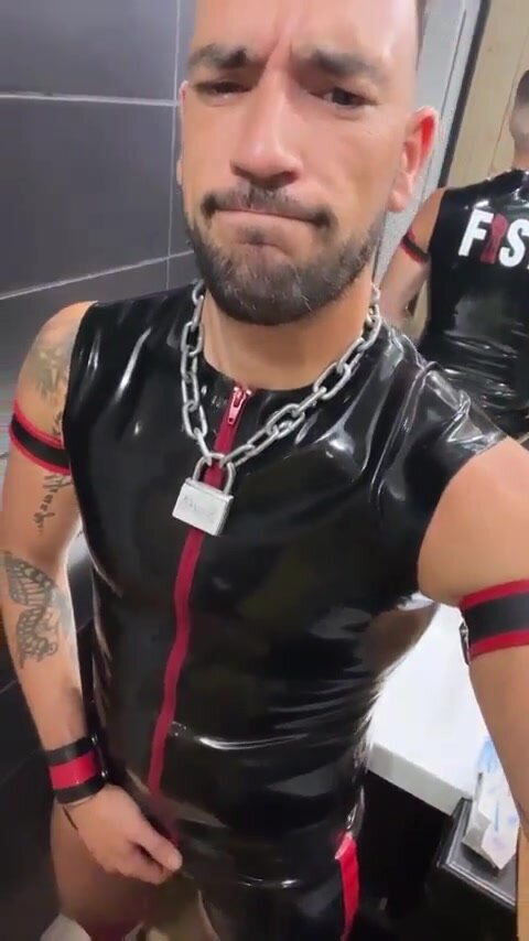 looking good in rubber with chain and tattoo