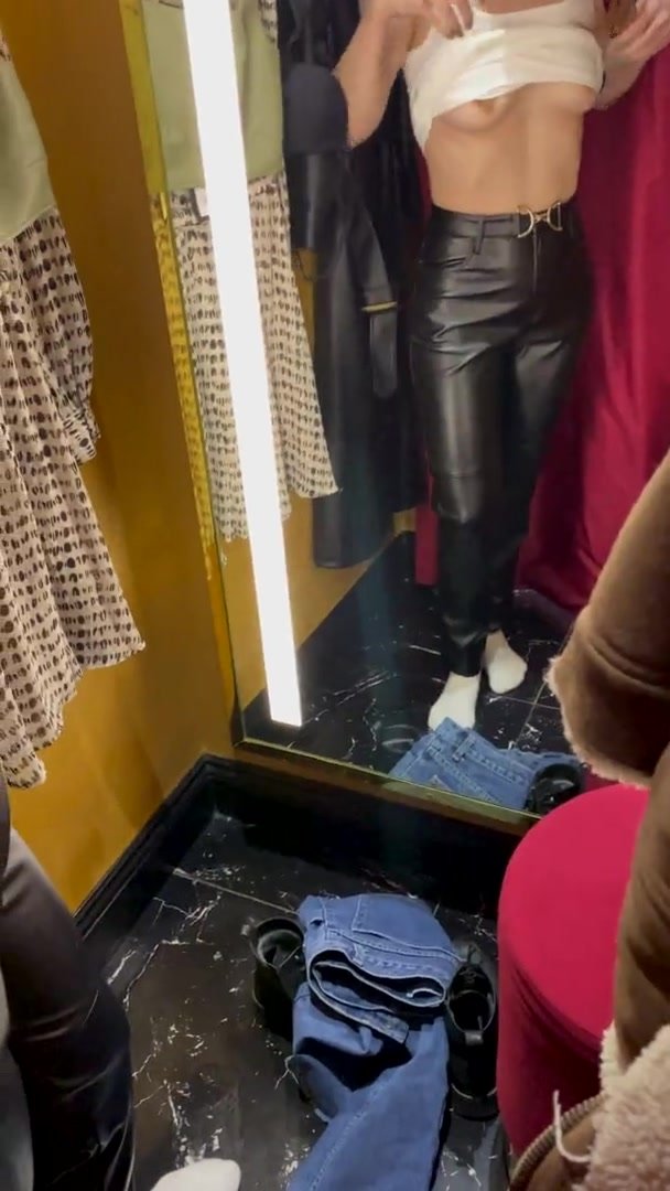 girl tries on outfits for you in dressing room