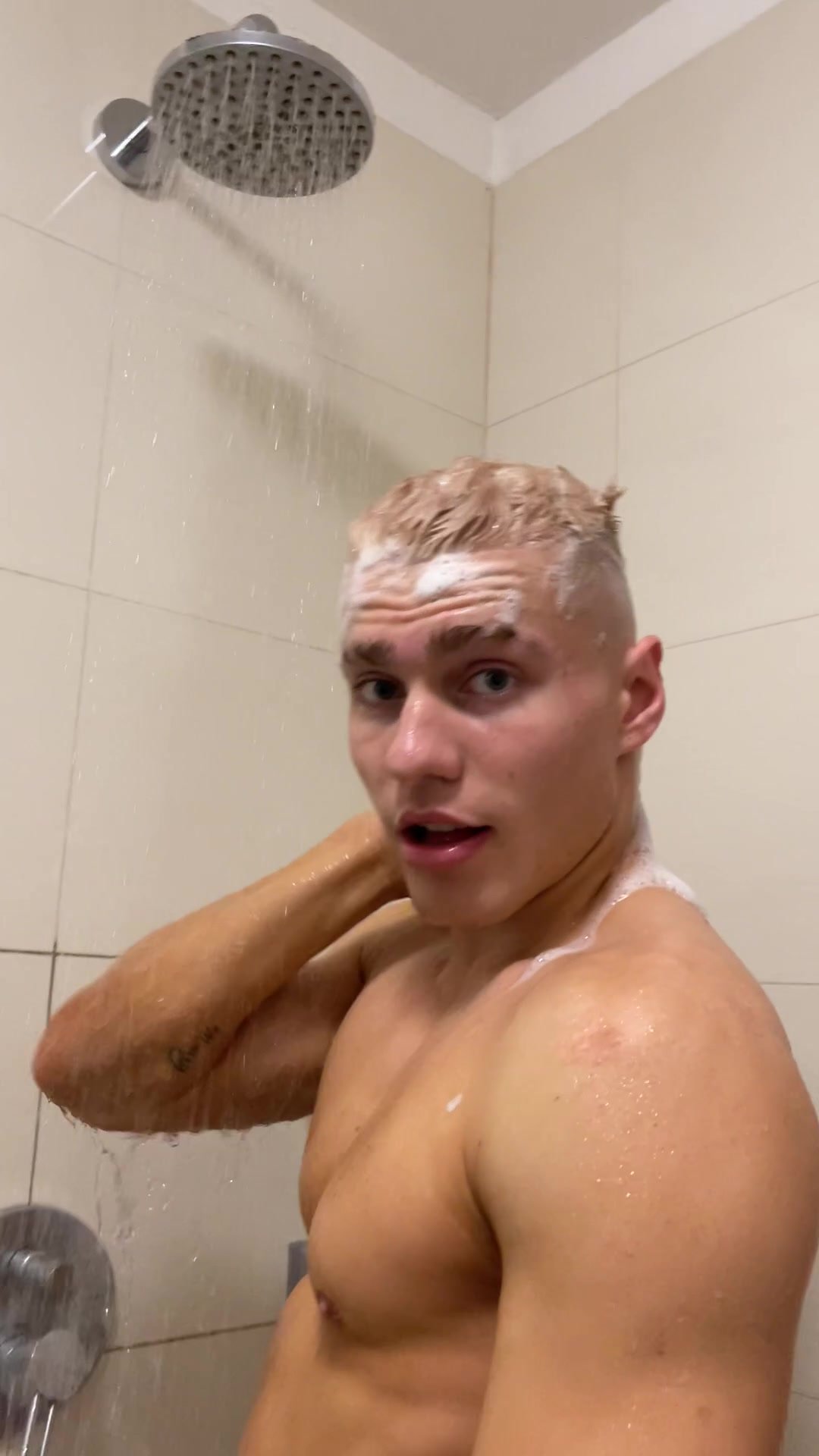 Beautiful guy caught in the shower