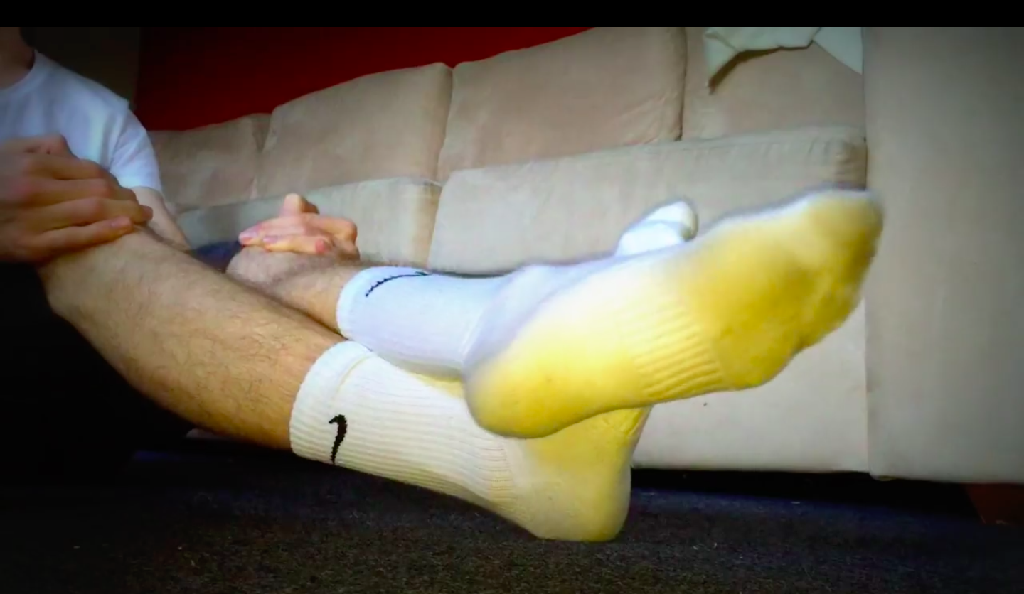 Young male in sweaty white Nike socks