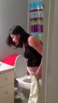 Pregnant woman with morning sickness vomits in toilet - ThisVid.com