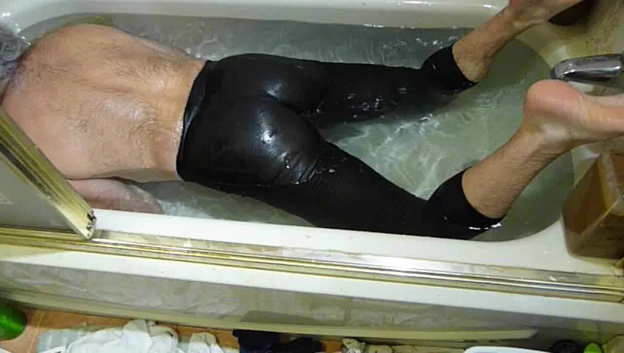 Male farting in spandex in bathtub