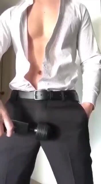 Men in suit use a vibrator to cum