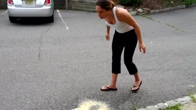 Fit girl fails banana sprite challenge in parking lot