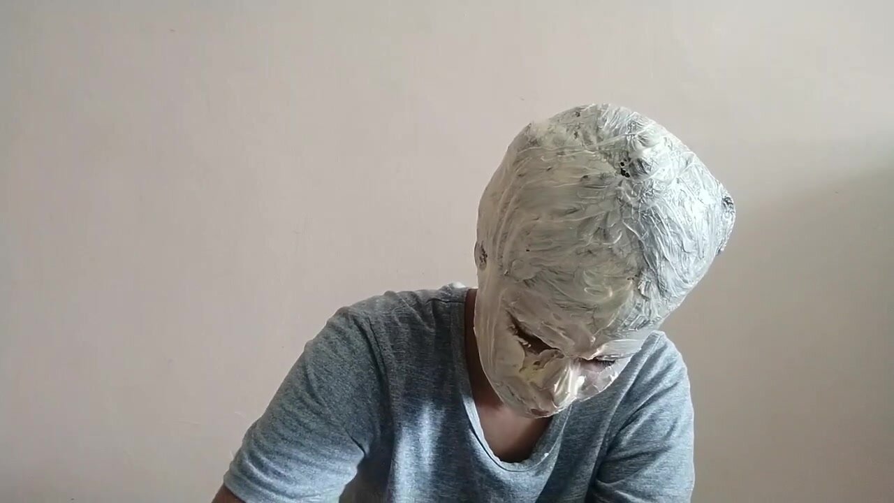 Girl covers her head in butter. - video 2