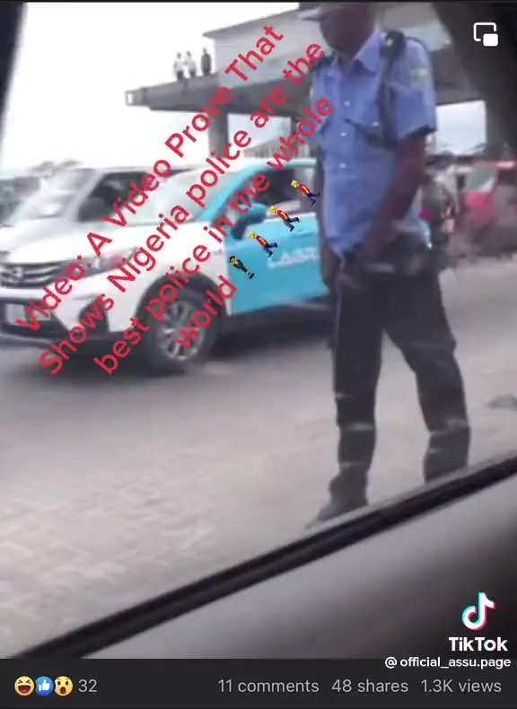 Nigerian police stands in middle of road pissing