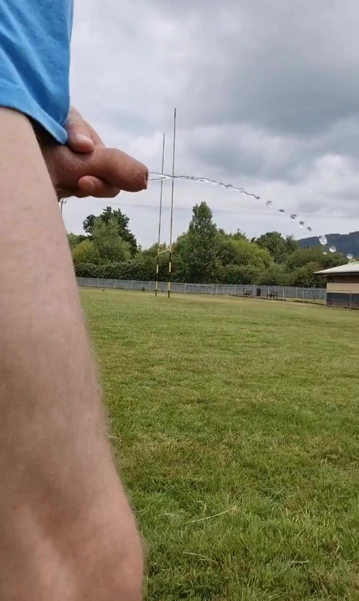 Uncut Brit flopping out of shorts and pissing outside