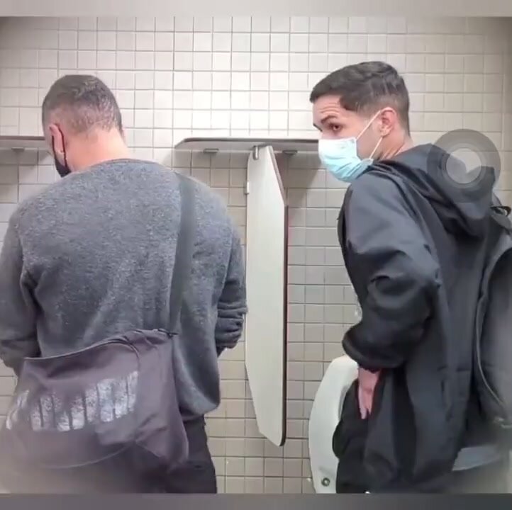 Spy cruising in public bathroom