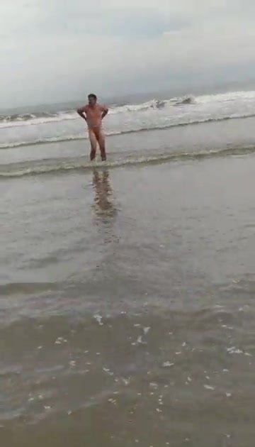Couple naked at nudist beach