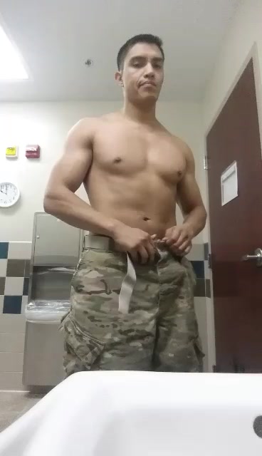 solider plays with cock in the bathroom