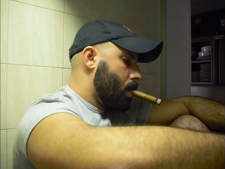 Hot beard man smoking cigar