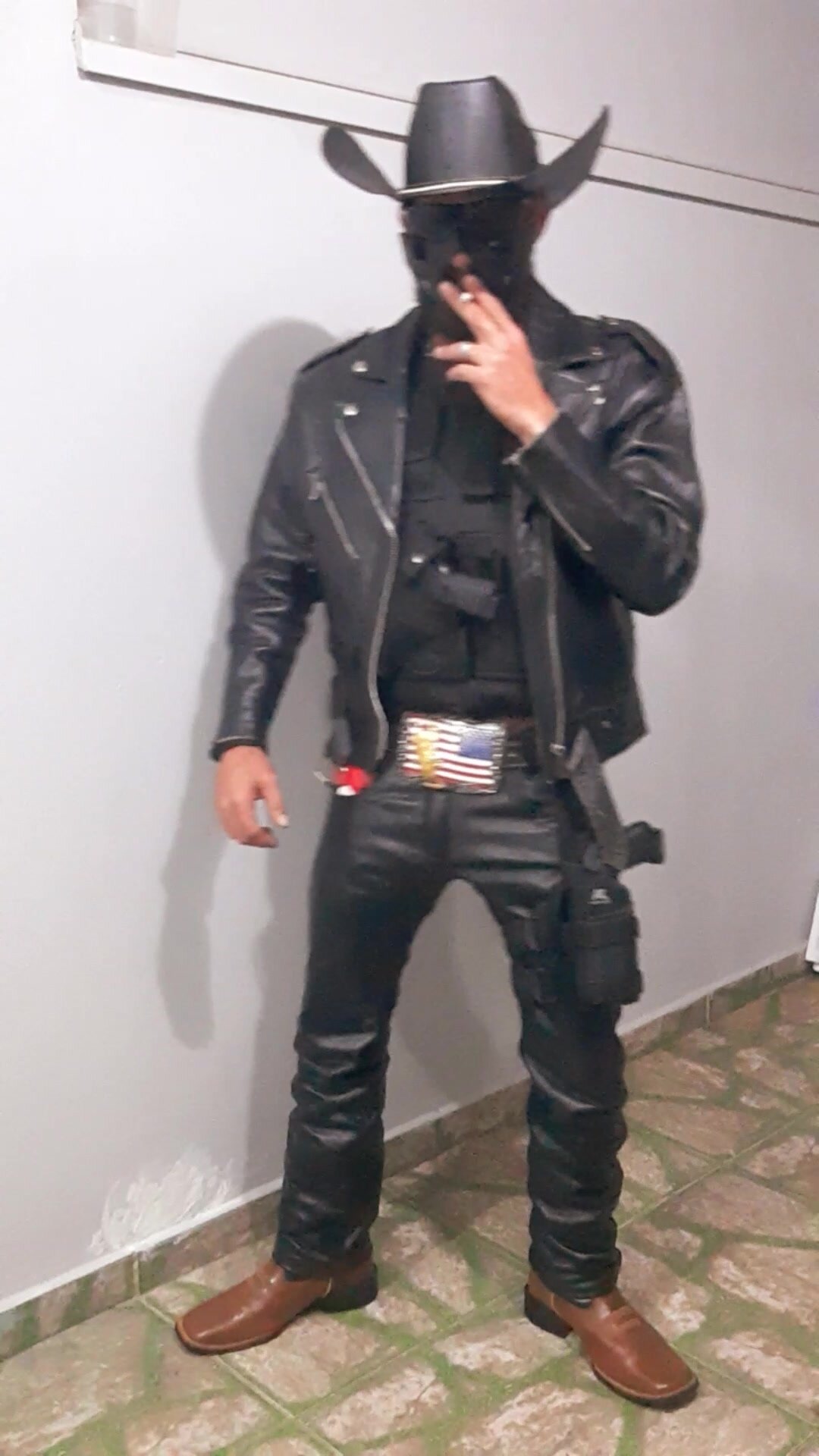 Mix cowboy with cop,leather smoking.