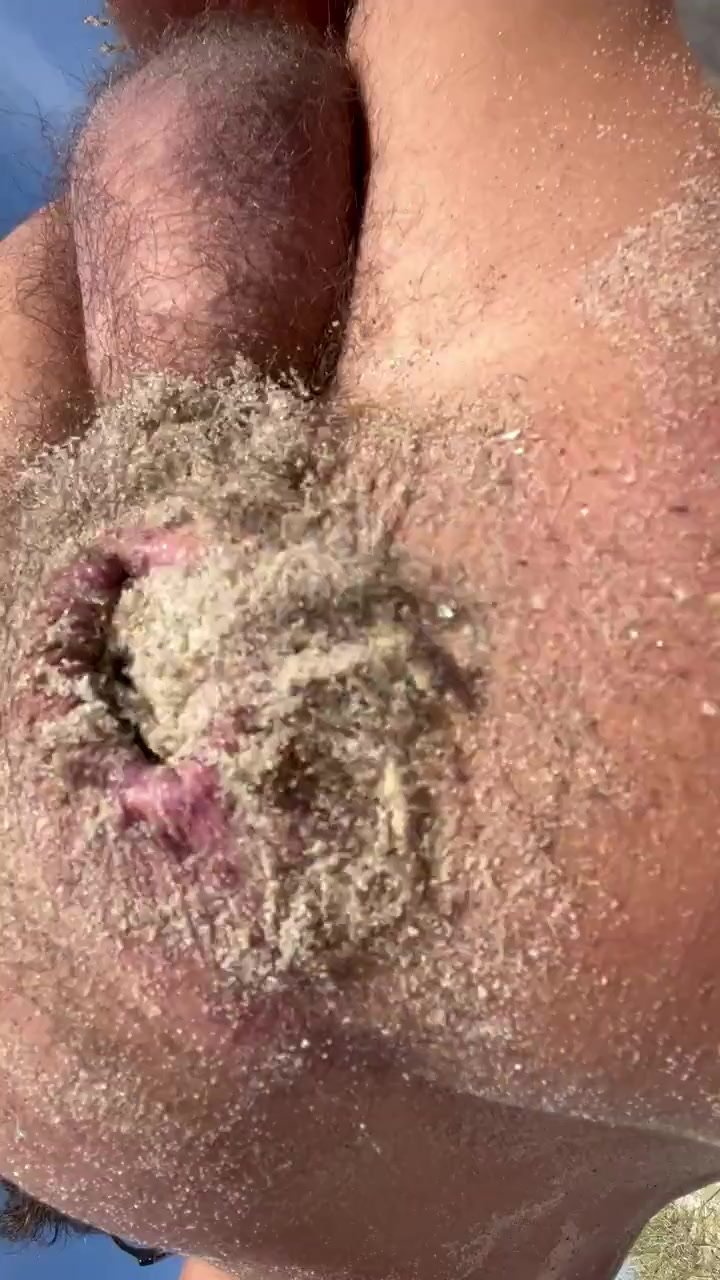 Slut pushing sand out of his cunt