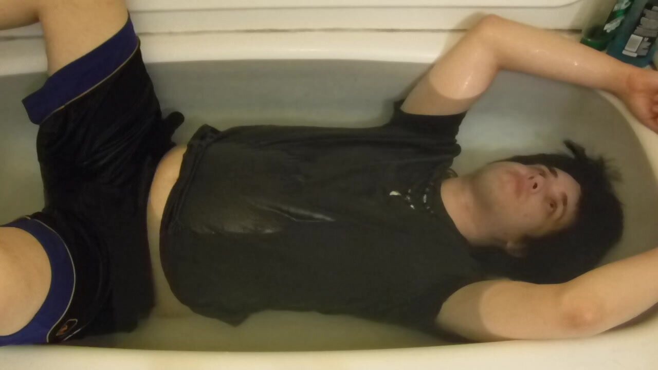 Clothed Guy In Bathtub Holding Breath