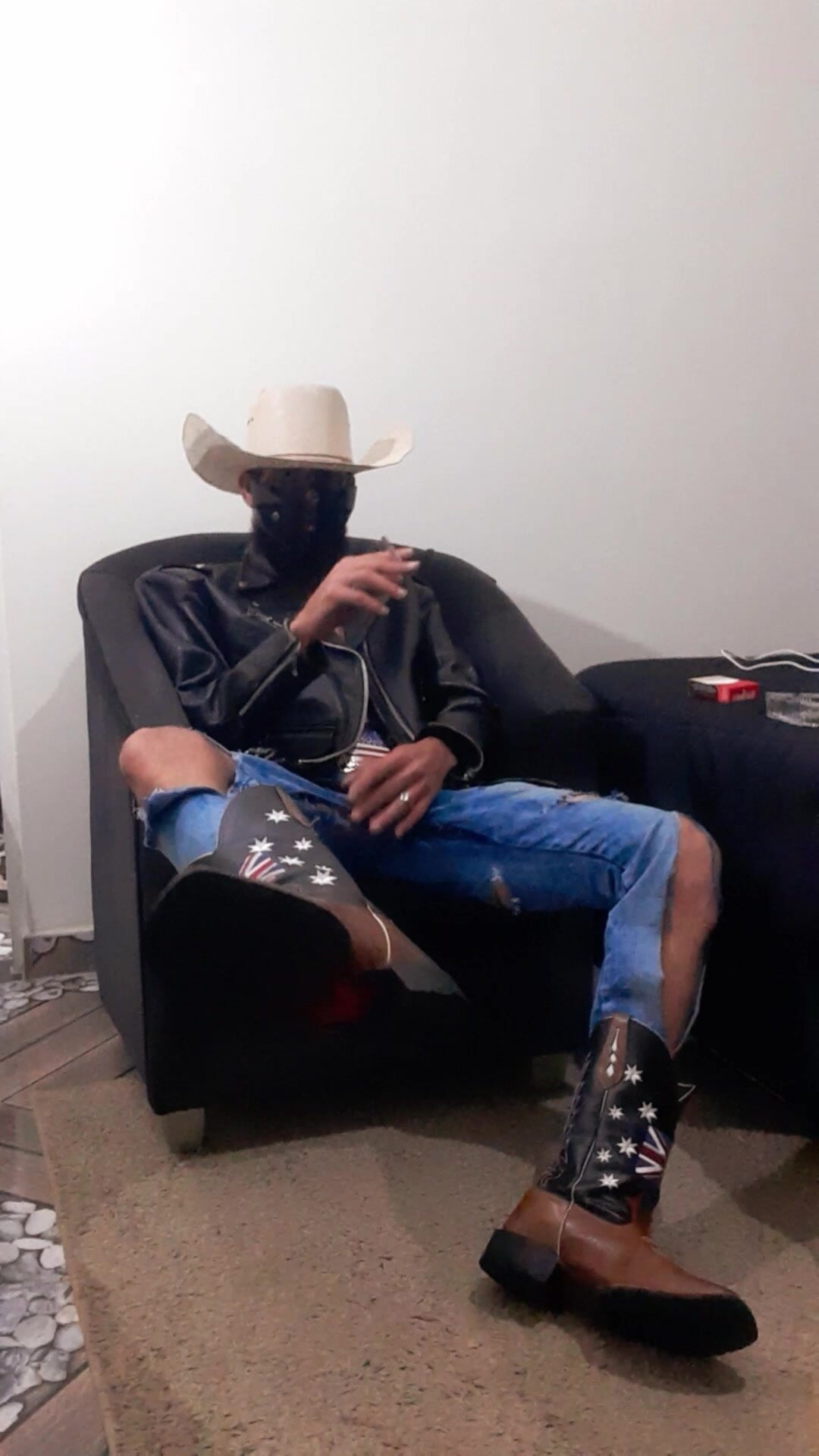 Cowboy ripped jeans smoking marlboro